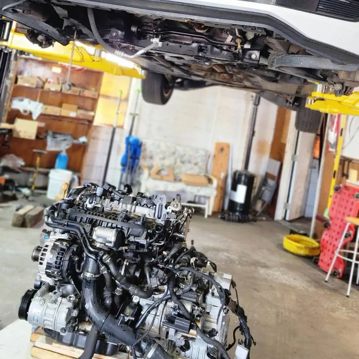 Engine and transmission assembly removed during major mechanical repair at The Engine Block